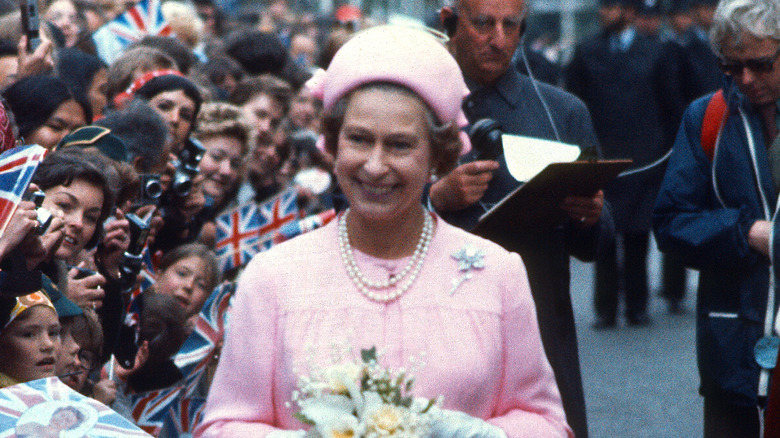 Queen Elizabeth smiles at an engagement