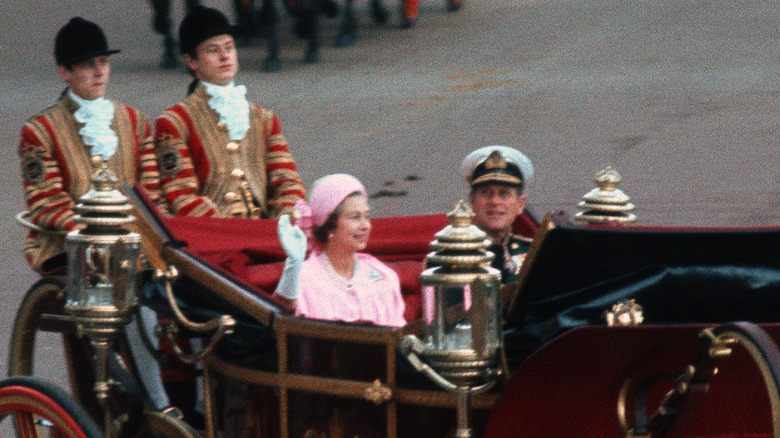 Queen Elizabeth and Prince Philip in a carriage