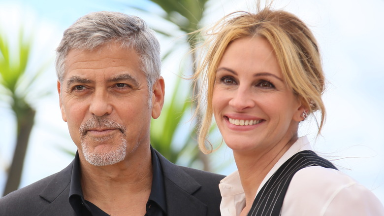 George Clooney and Julia Roberts, both smiling 