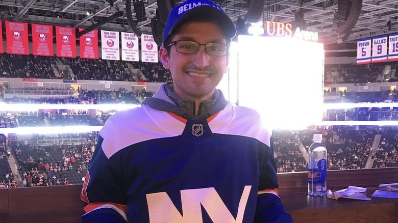 Daniel Macchio, wearing an Islander jersey, at a hockey game 