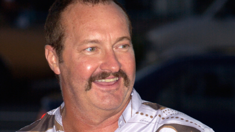 Randy Quaid smiling