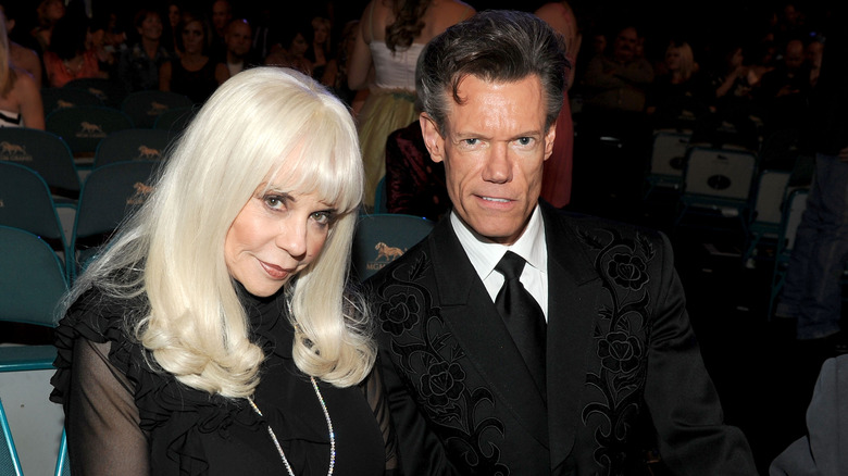 Randy Travis and Elizabeth Hatcher posing