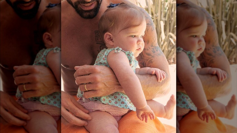 Ricky Martin holding daughter Lucia