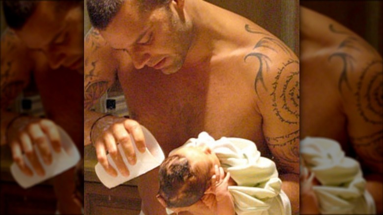 Ricky Martin washing baby's hair