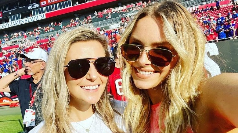 Camille Kostek with Rob Gronkowski's sister, smiling