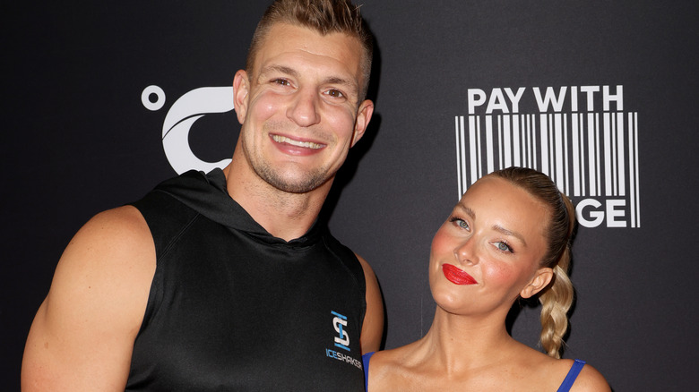 Rob Gronkowski and Camille Kostek posing