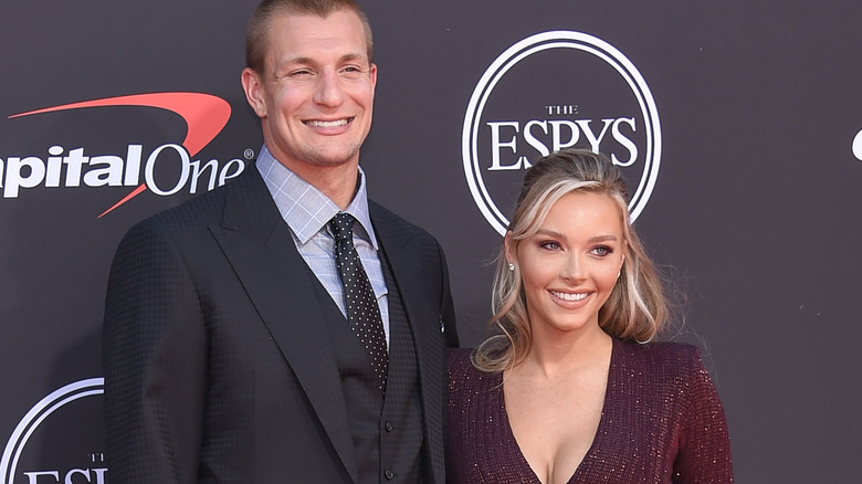 Rob Gronkowski and Camille Kostek posing