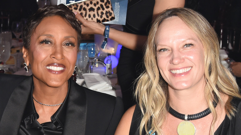 Robin Roberts and longtime girlfriend Amber Laign smiling