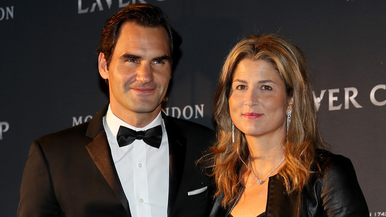 Mirka Federer and Roger Federer posing