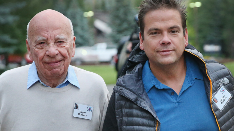 Rupert Murdoch walks with son Lachlan