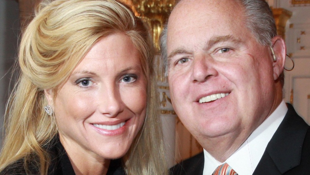 Kathryn Adams Limbaugh smiles next to husband Rush Limbaugh at an event