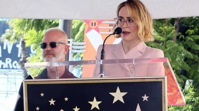 Ryan Murphy and Sarah Paulson posing