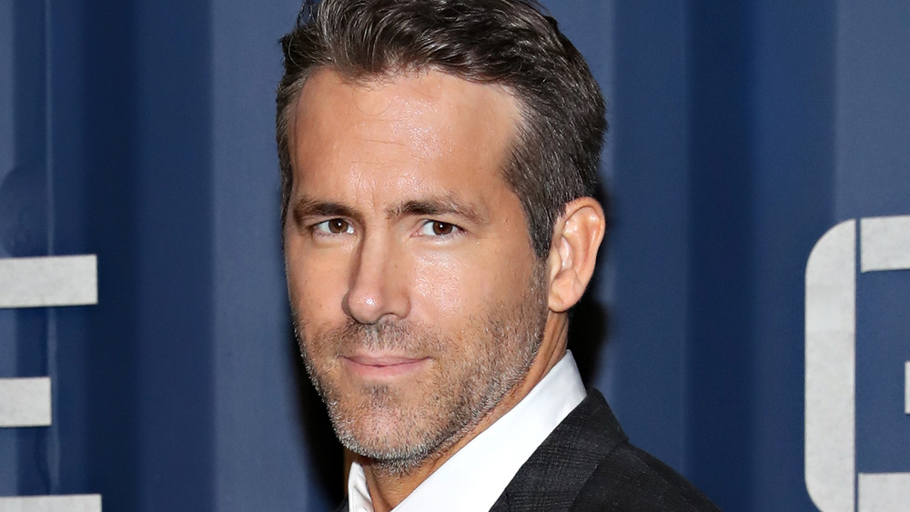 Ryan Reynolds smoulders at the camera on a photo call