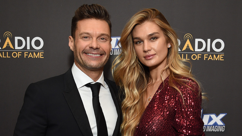 Ryan Seacrest and Shayna Taylor posing