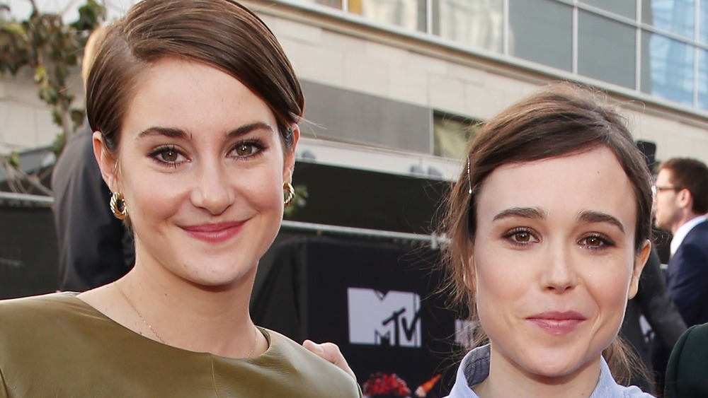 Shailene Woodley and Elliot Page smiling next to each other while posing for the cameras