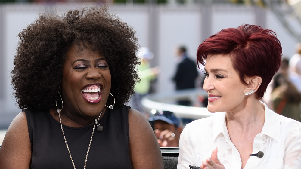 Sheryl Underwood and Sharon Osbourne laughing together at an event