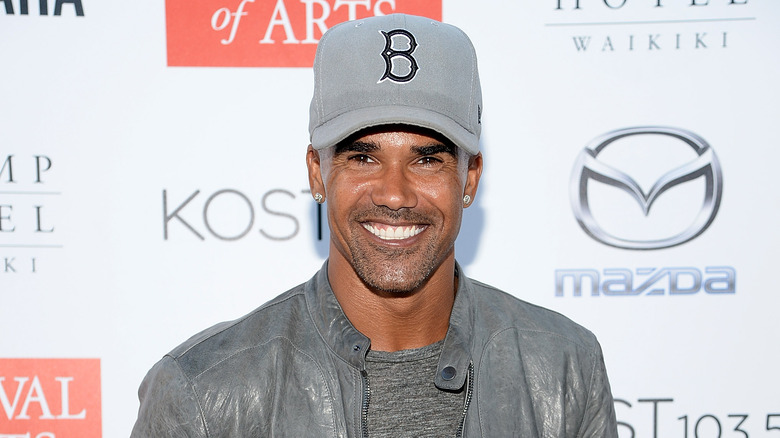 Shemar Moore with Boston Red Sox hat, smiling