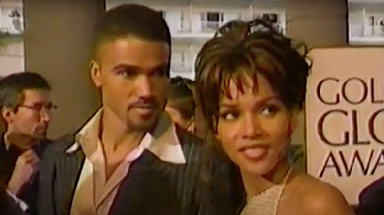 Shemar Moore, Halle Berry, both looking to the right