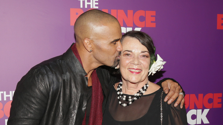 Shemar Moore kissing Marilyn Wilson Moore on cheek