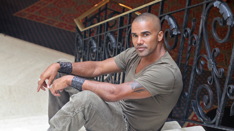 Shemar Moore sitting on staircase
