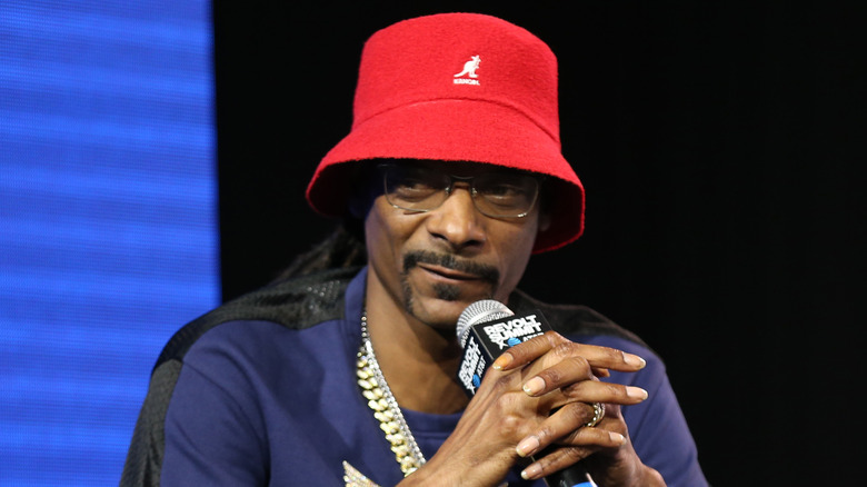 Snoop Dogg holding microphone