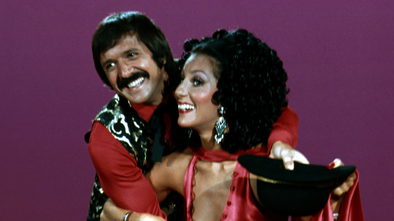 Sonny and Cher smiling while performing