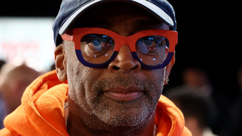 Spike Lee wearing Knicks colored glasses 