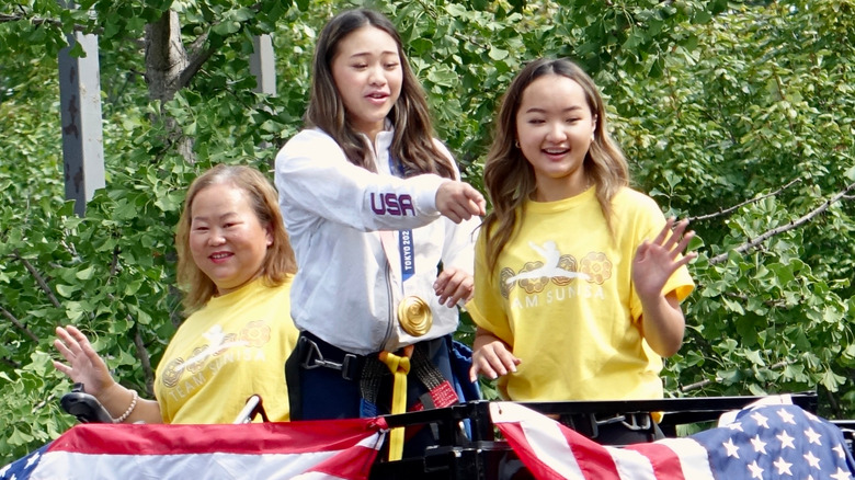 Suni Lee with her sister and mom