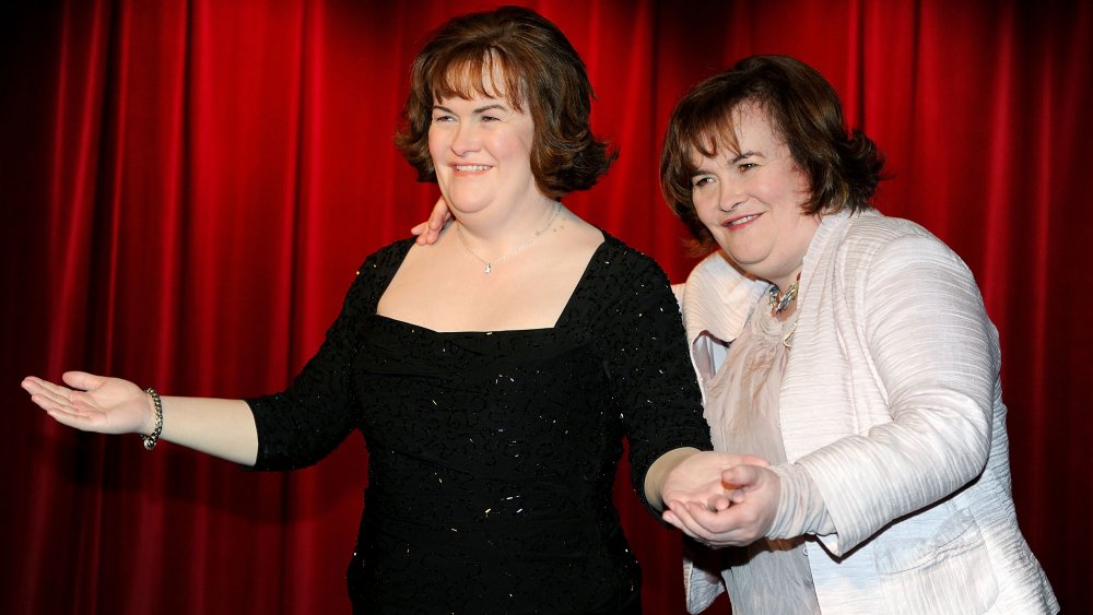 Susan Boyle poses for photos alongside her new wax figure at the official launch of the new Madame Tussauds venue in Blackpool