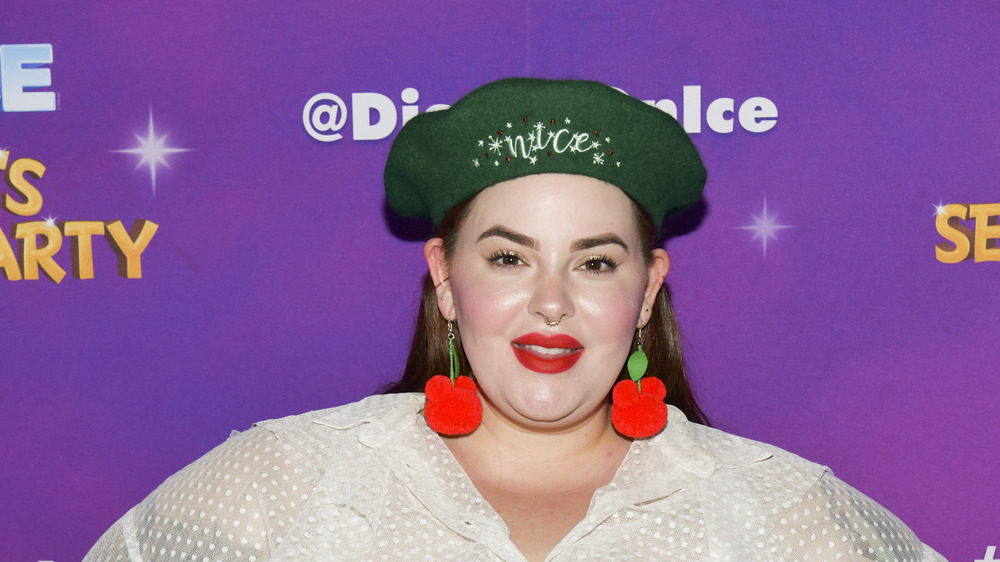Tess Holliday smiling in red lipstick