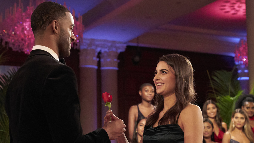 Rachael Kirkconnell accepting a rose from Bachelor Matt James