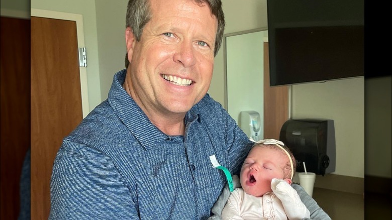 Jim Bob Duggar holding baby