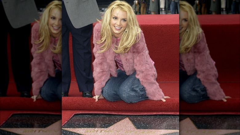 Britney Spears posing in front of Walk of Fame