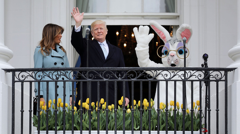 Melania and Donald Trump with a shirtless Easter bunny