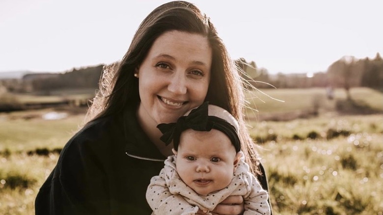 Tori Roloff, holding her baby, smiling 