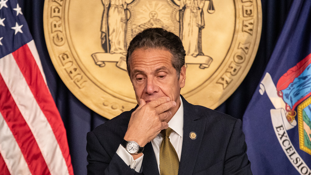 Andrew Cuomo with hand over his mouth