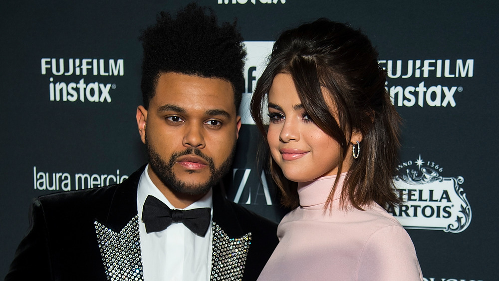 The Weeknd and Selena Gomez posing