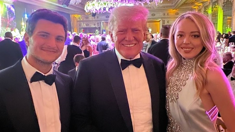 Michael Boulos, Donald Trump, and Tiffany Trump smiling