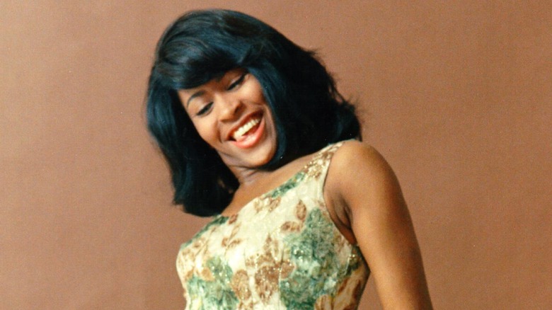 Tina Turner smiling while dancing