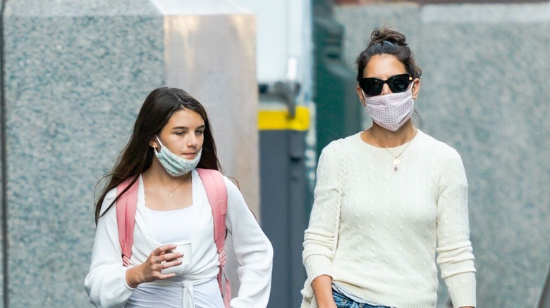 Suri Cruise and Katie Holmes walking