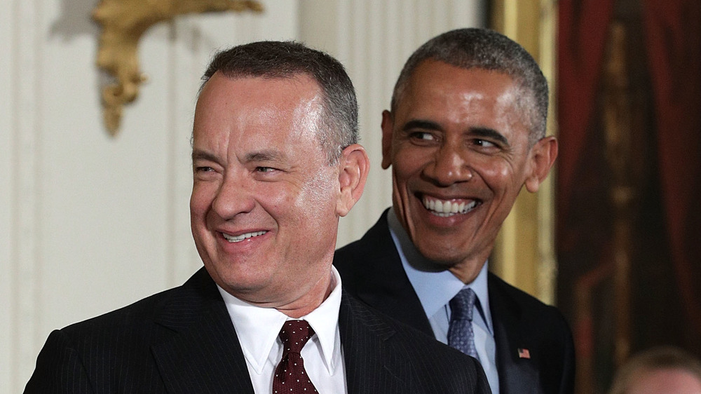 Tom Hanks and Barack Obama smiling