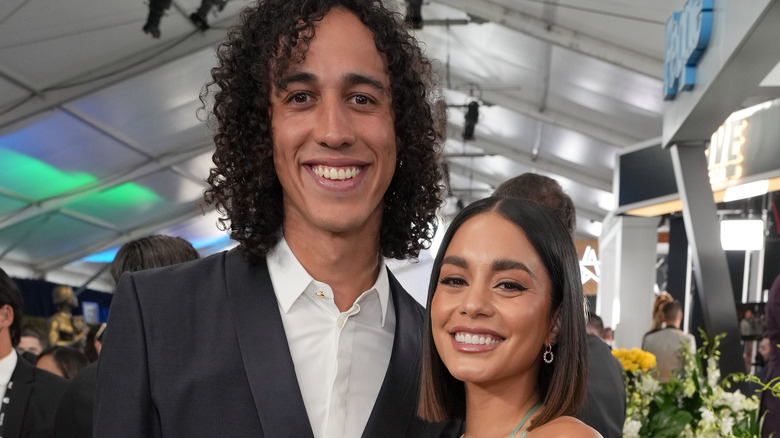 Cole Tucker and Vanessa Hudgens at an event