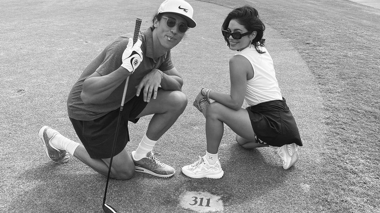 Cole Tucker and Vanessa Hudgens golfing