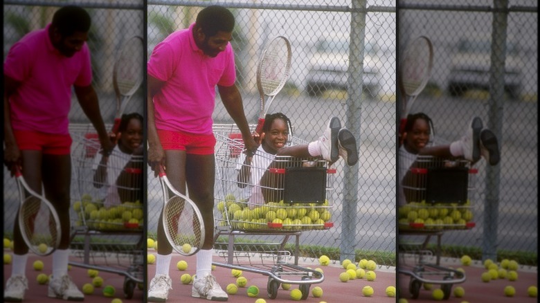 Richard Williams pushing Venus Williams in a shopping cart