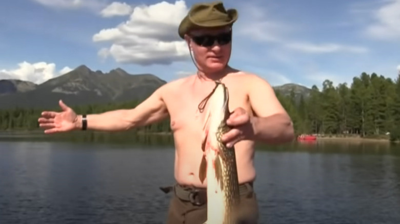 Shirtless Vladimir Putin holding fish