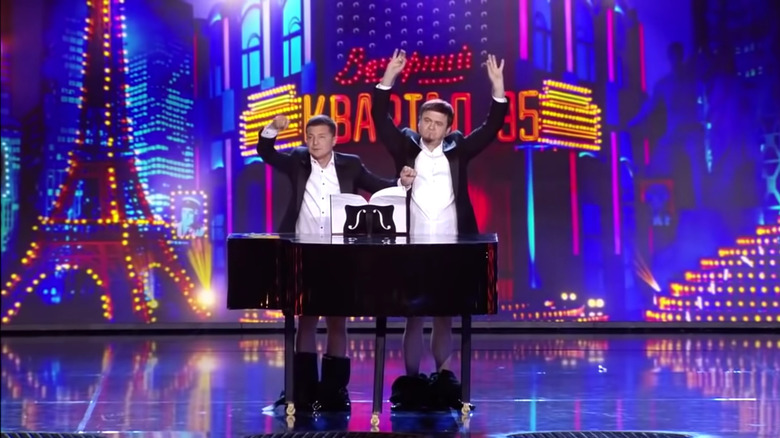 Volodymyr Zelenskyy on stage with a piano