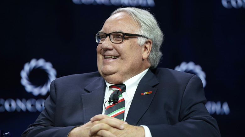 Howard Buffett sitting on stage smiling