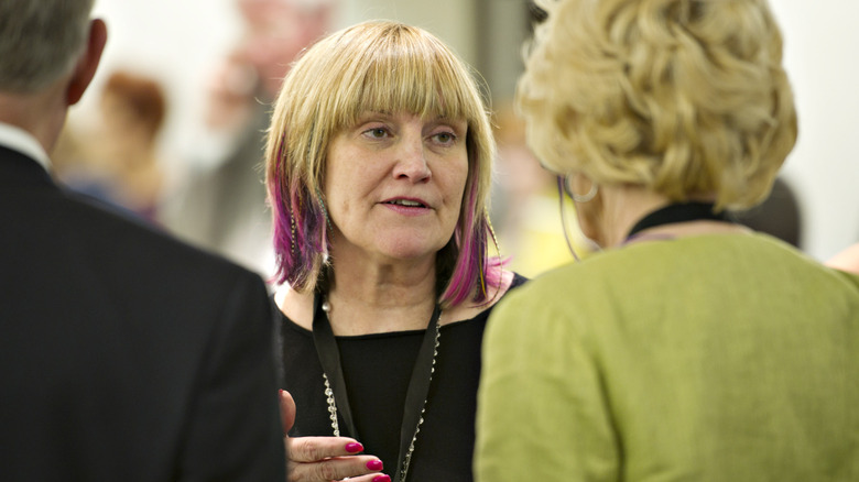 Susie Buffett speaking with purple hair