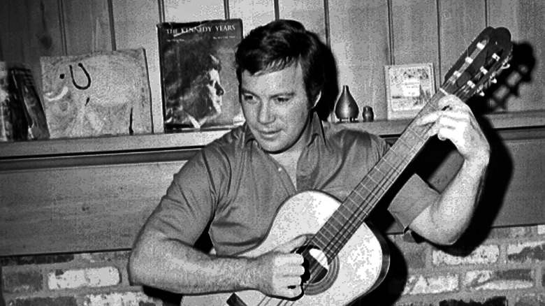 William Shatner playing guitar