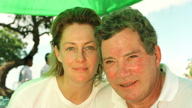 Nerine Kidd and William Shatner in a golf cart